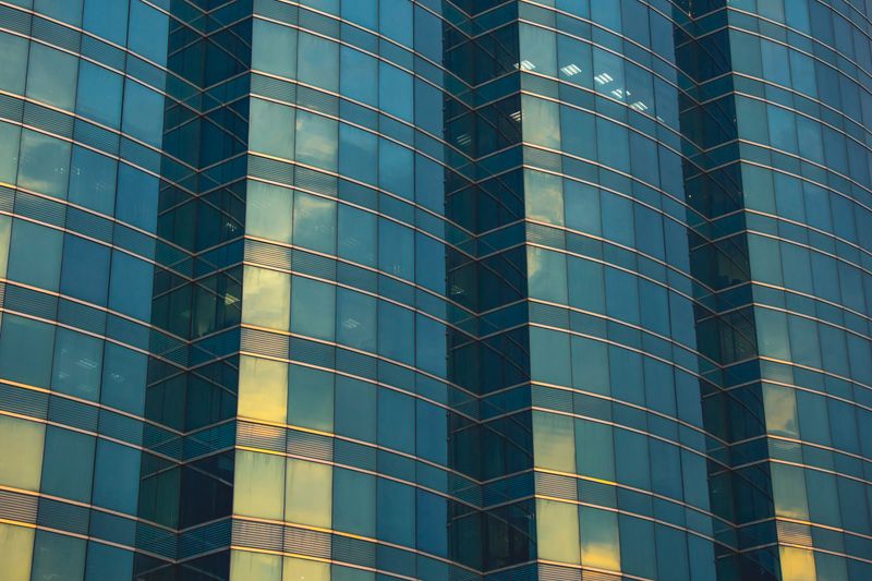 A contemporary glass facade in Kowloon showcasing modern architectural design