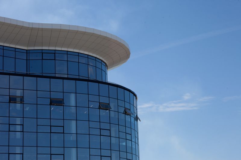Close-up of a modern glass building facade against a clear sky