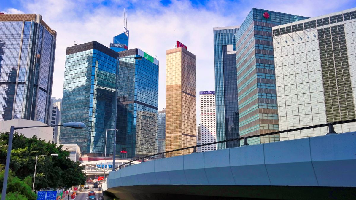 Stunning view of Hong Kong's vibrant skyscrapers and urban architecture under a blue sky